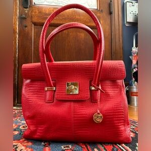 Knomo London teaberry/watermelon colored handbag.